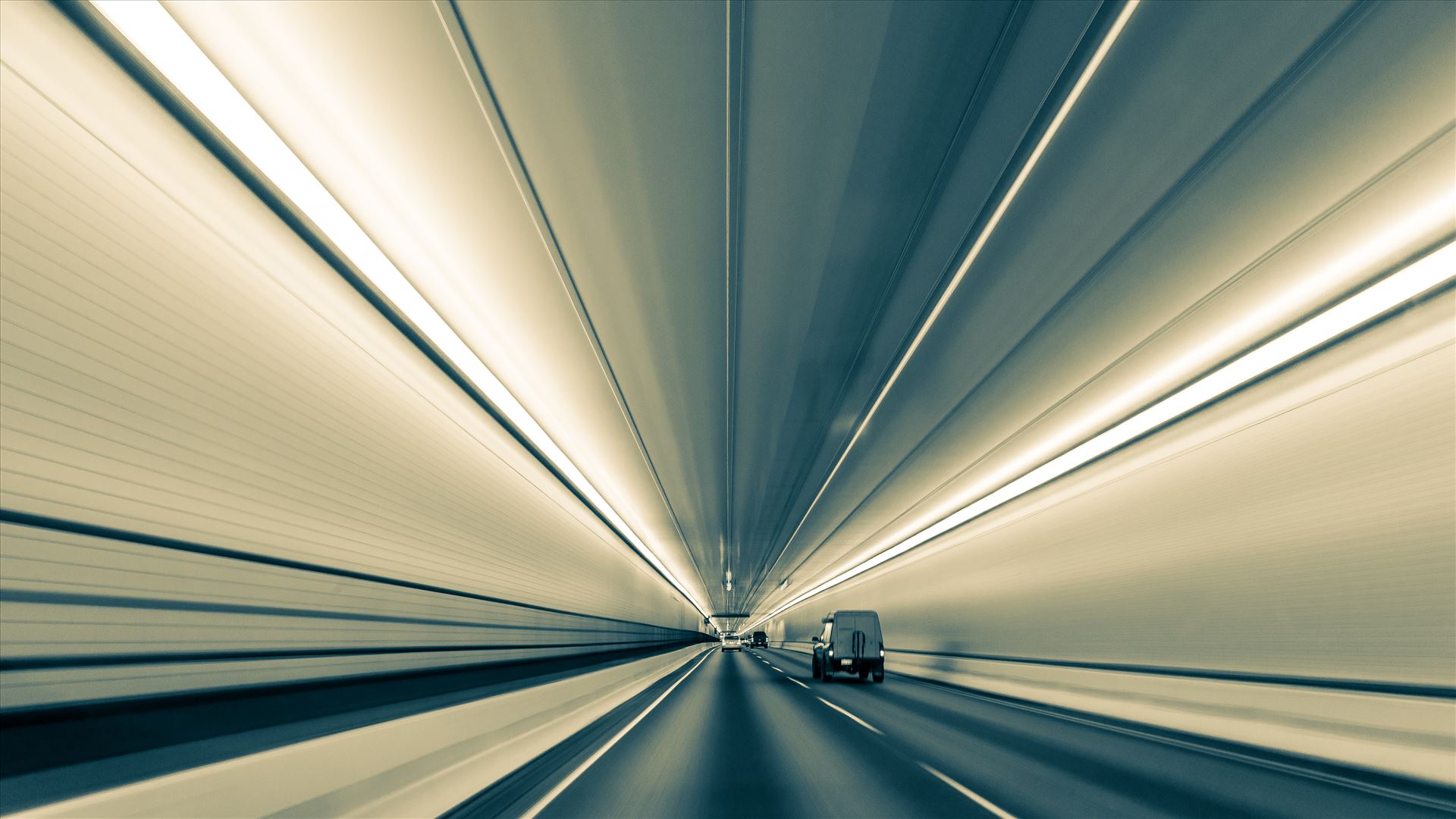 Converging Lines in Eisenhower Tunnel (Black and White Version) - Lines nearly converge to infinity, in this long exposure handheld shot in Eisenhower Tunnel. Opened in 1973, the Eisenhower Tunnel in the Rocky Mountains of Colorado on interstate 70 is highest vehicle tunnel in the world at 11,155 feet. This version B&W. by Scott Smith Photos