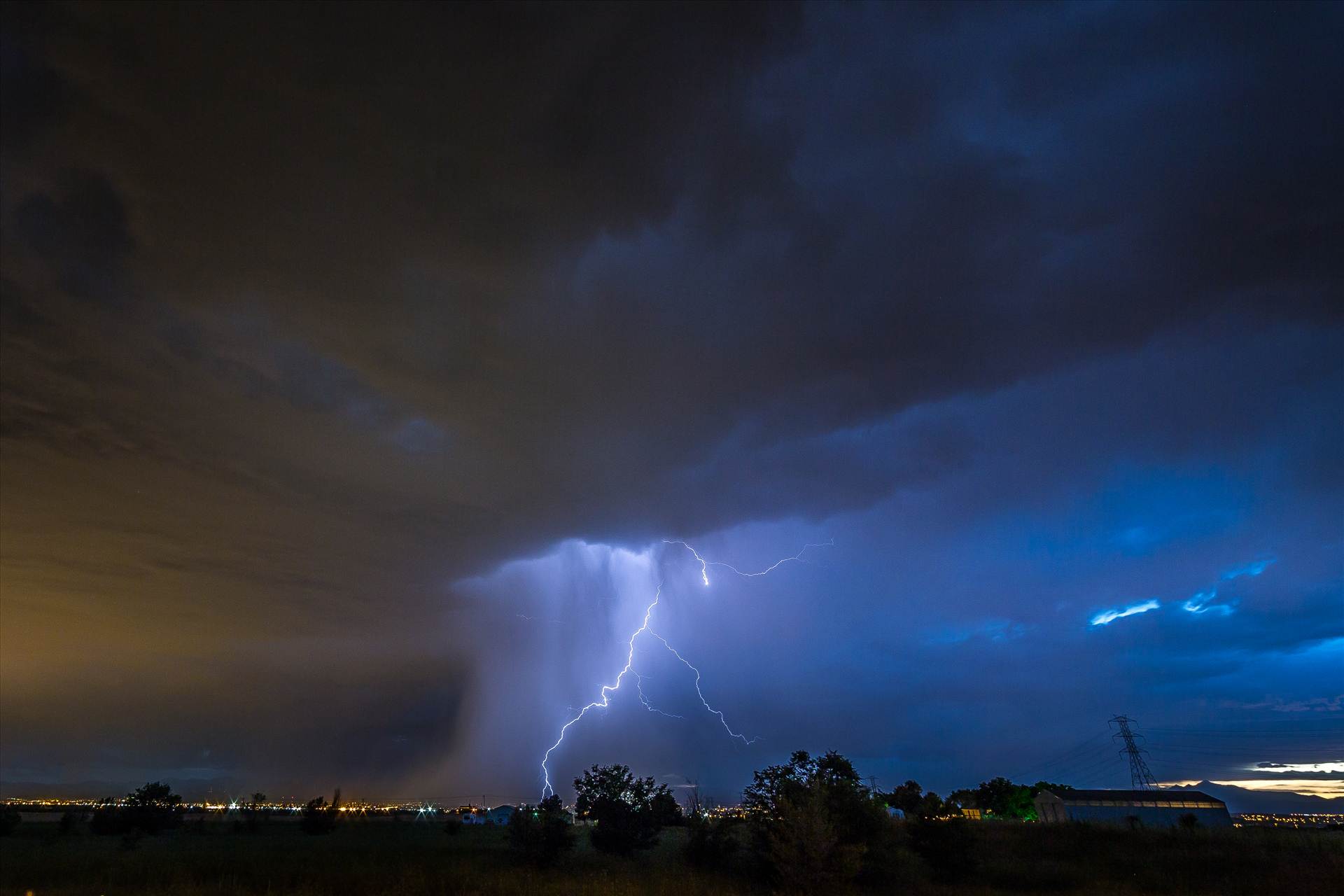 Lightning Flashes 8 - A series of shots from the end of the street, during a powerful lightning storm near Reunion, Colorado. by Scott Smith Photos