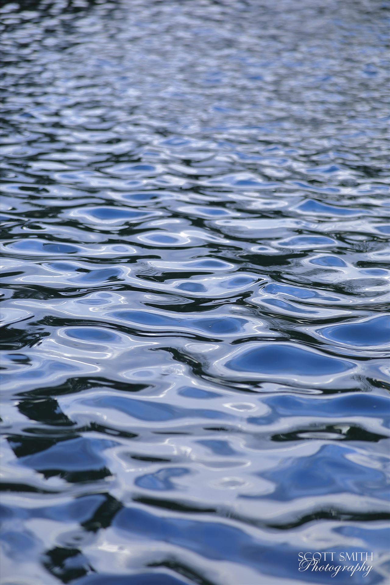 Glassy Water - Water ripples in the waves just before sunset at Grant Park, in Thornton Colorado. by Scott Smith Photos