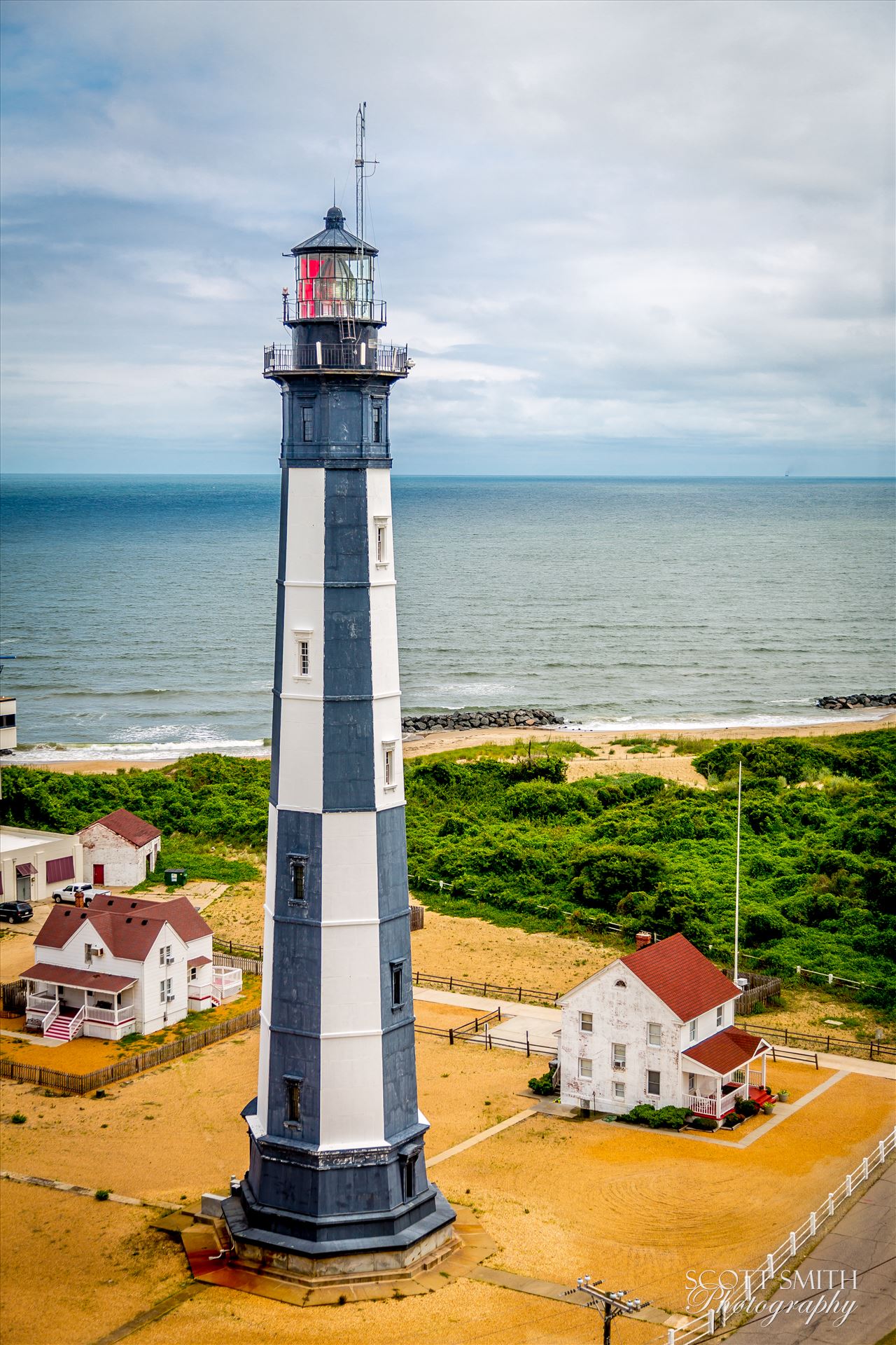 Cape Henry Lighthouse in Virgina - The newer Cape Henry lighthouse, taken from the original lighthouse, now retired. by Scott Smith Photos