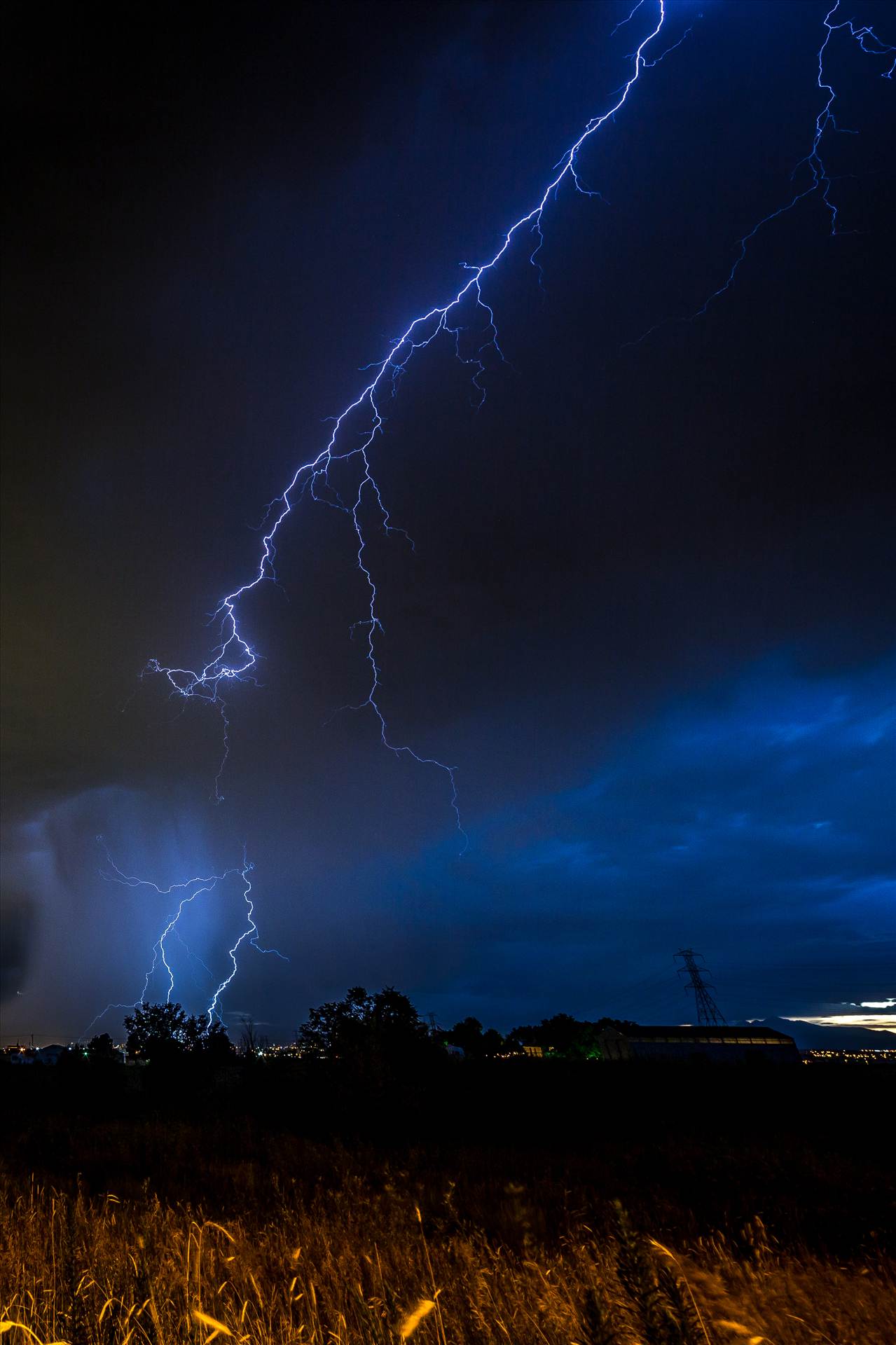 Lightning Flashes 4 - A series of shots from the end of the street, during a powerful lightning storm near Reunion, Colorado. by Scott Smith Photos