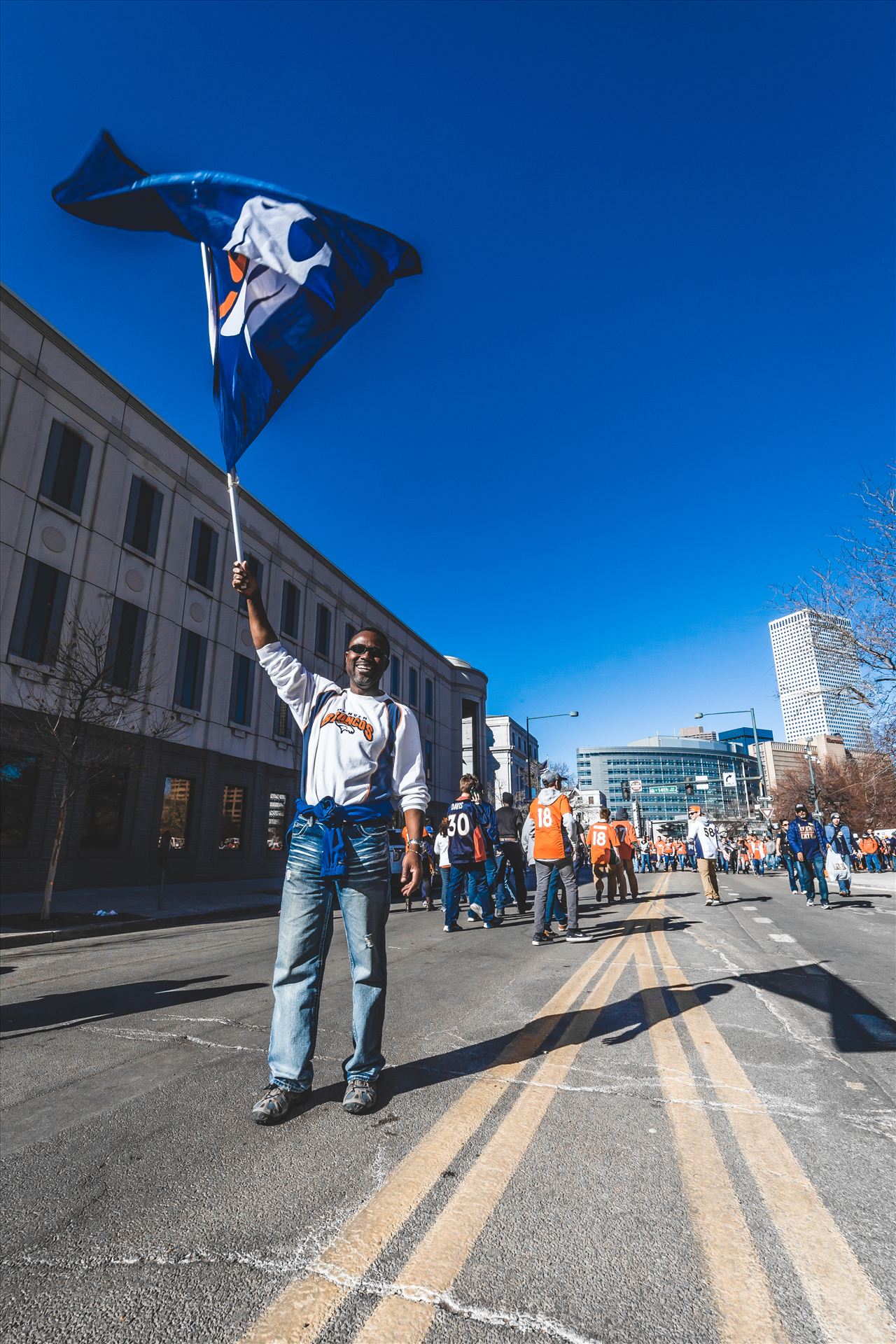 Last Fan Standing - Not quite the last, but he was happy to hold that flag up for just a few more moments so I could snap his photo. by Scott Smith Photos