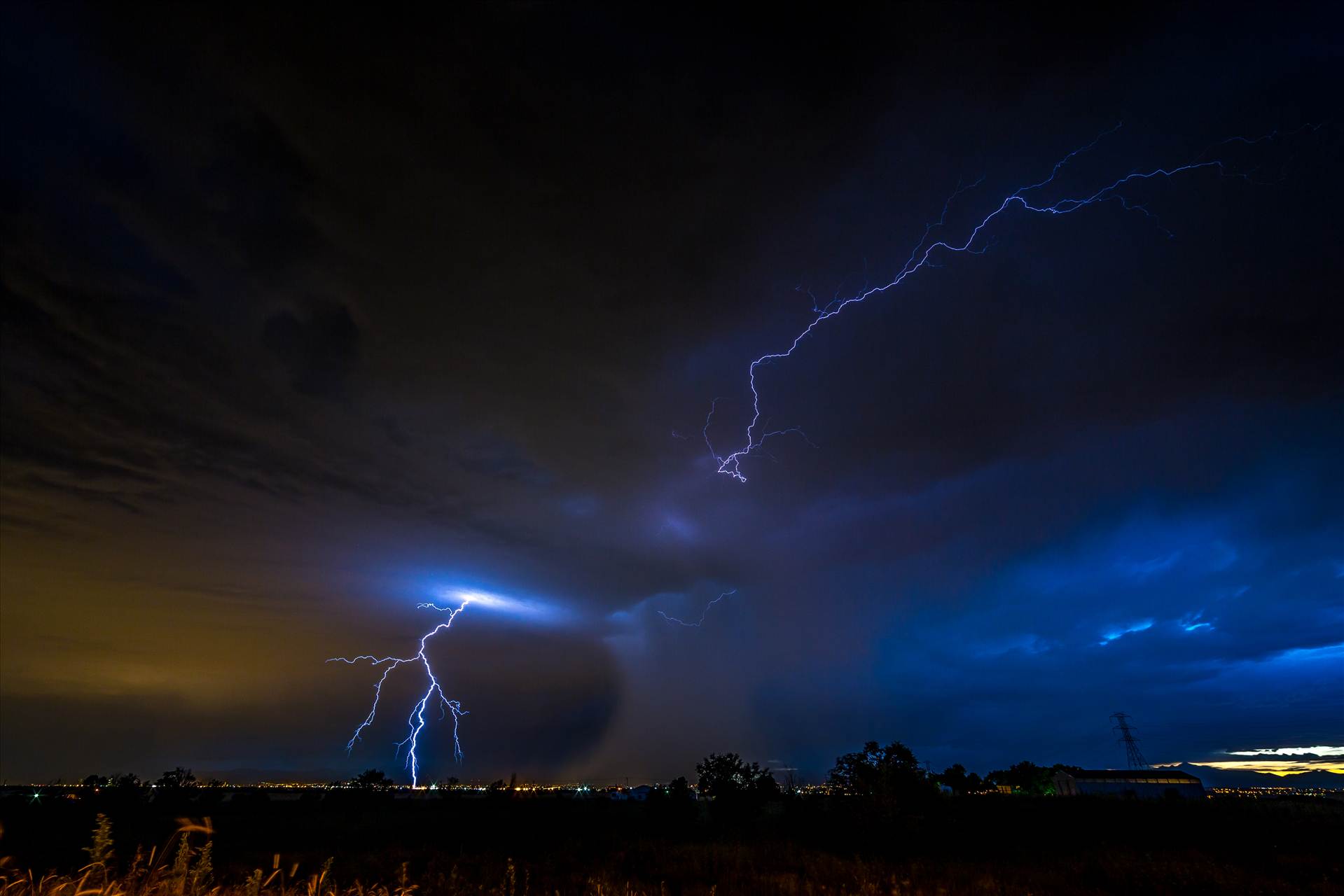 Lightning Flashes 5 - A series of shots from the end of the street, during a powerful lightning storm near Reunion, Colorado. by Scott Smith Photos