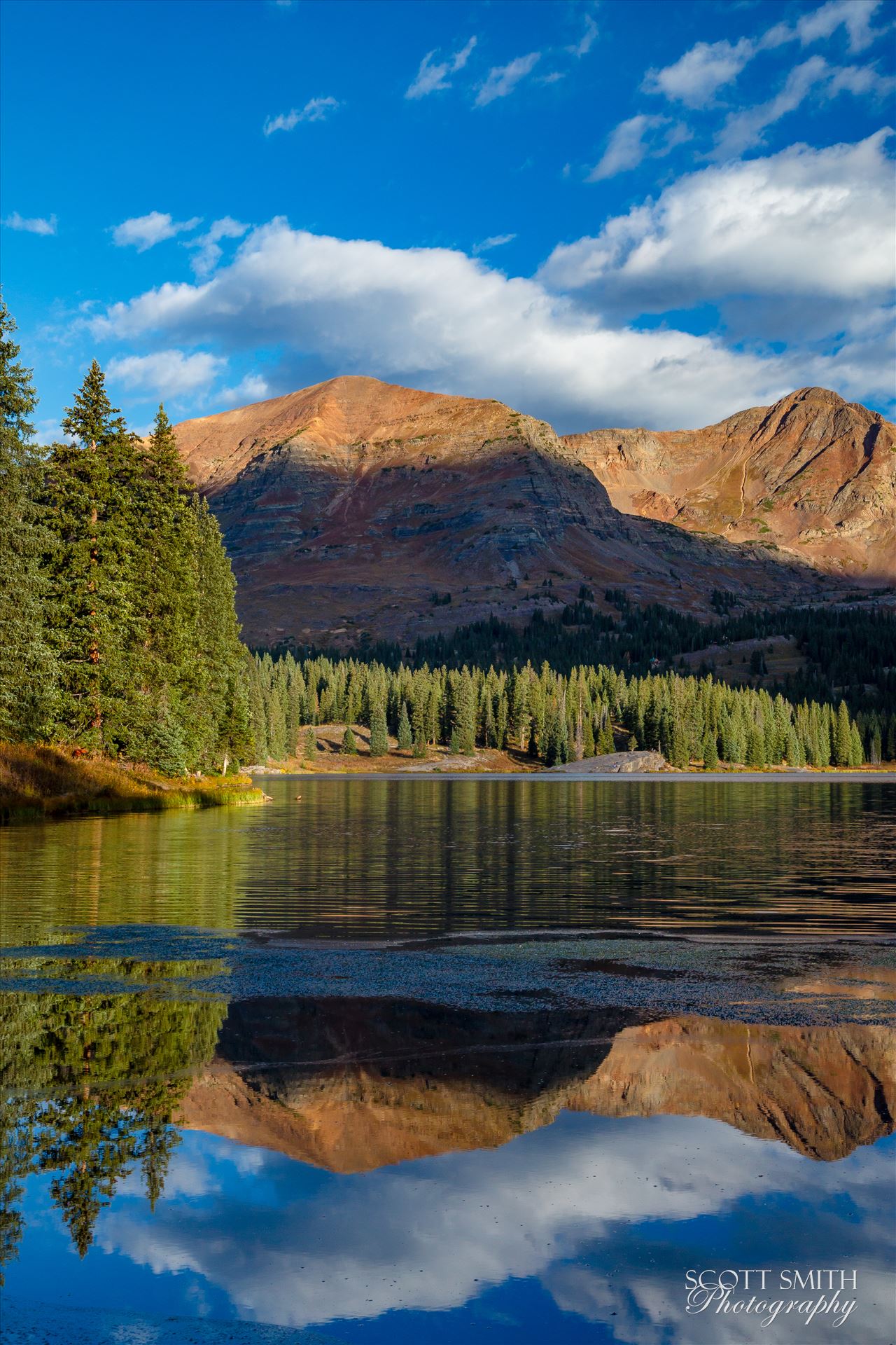 Lake Irwin Sunrise - Lake Irwin reflects the Ruby Range mountains just after sunrise near Kebler Pass,  Colorado. by Scott Smith Photos