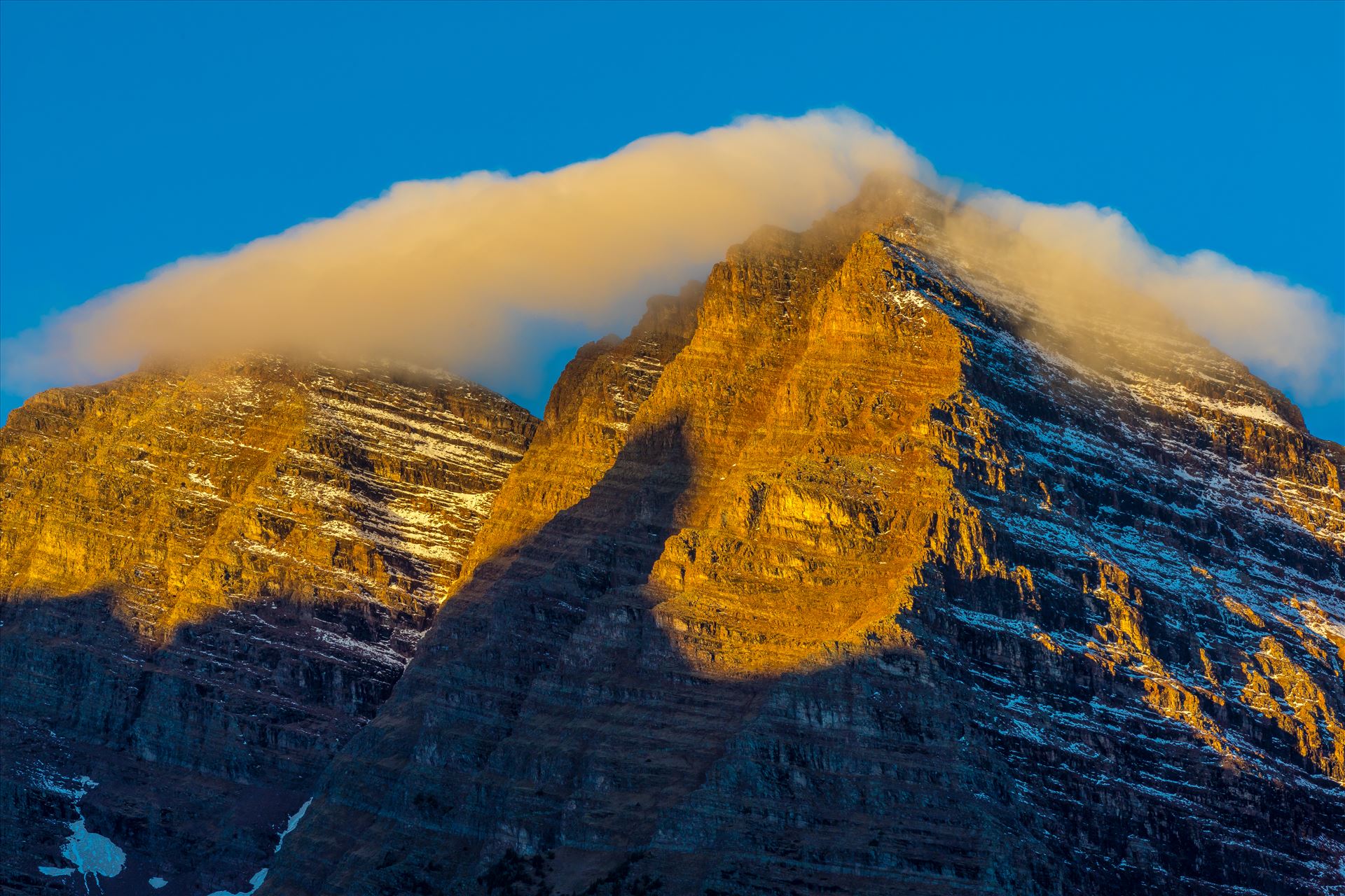 Maroon and Pyramiid Peaks Detail - Two stoic peaks rise above the Maroon Lake, waiting for the morning sun to reach out, as a low cloud slides over. by Scott Smith Photos