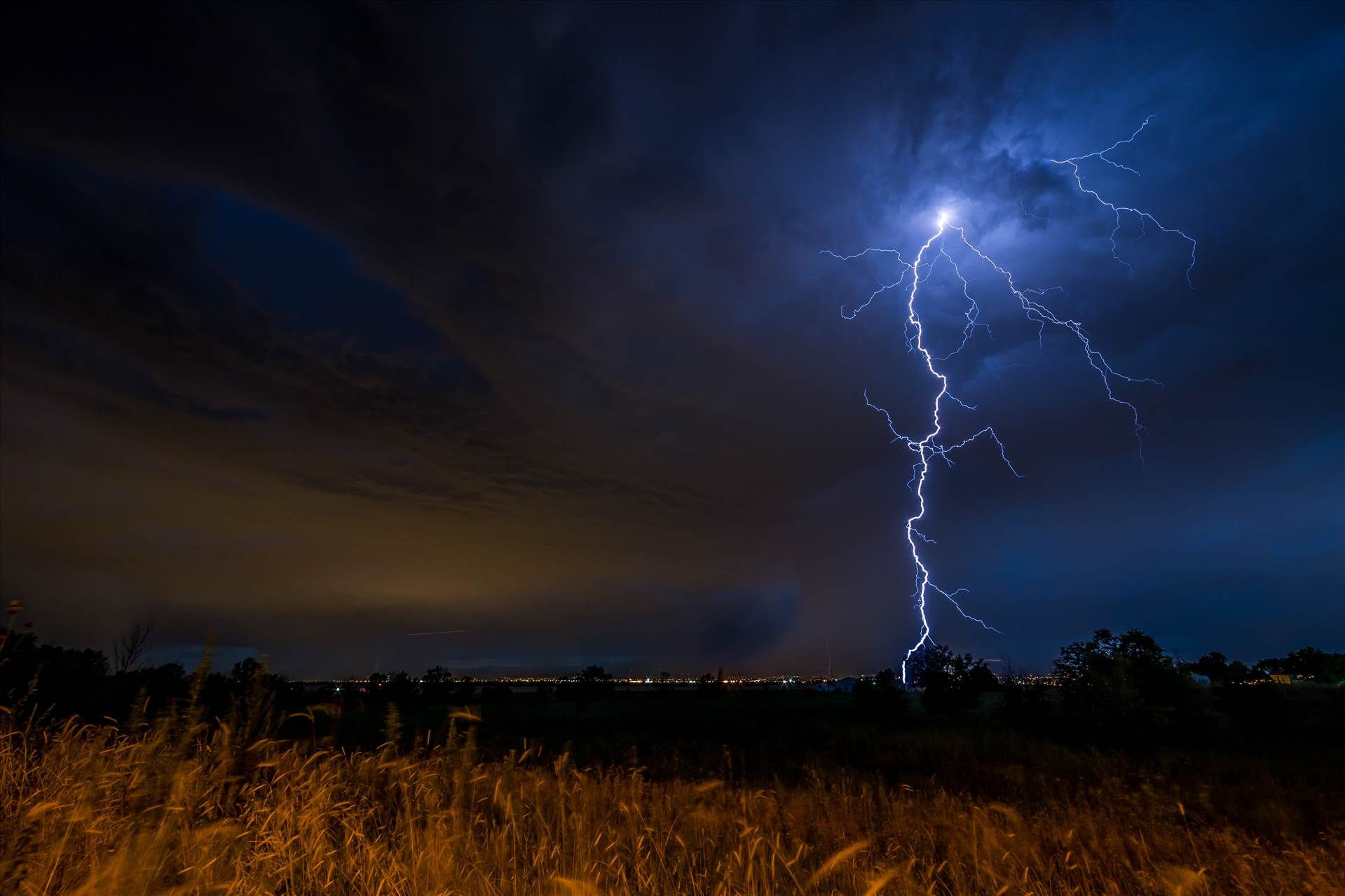 Lightning Flashes - A series of shots from the end of the street, during a powerful lightning storm near Reunion, Colorado. by Scott Smith Photos