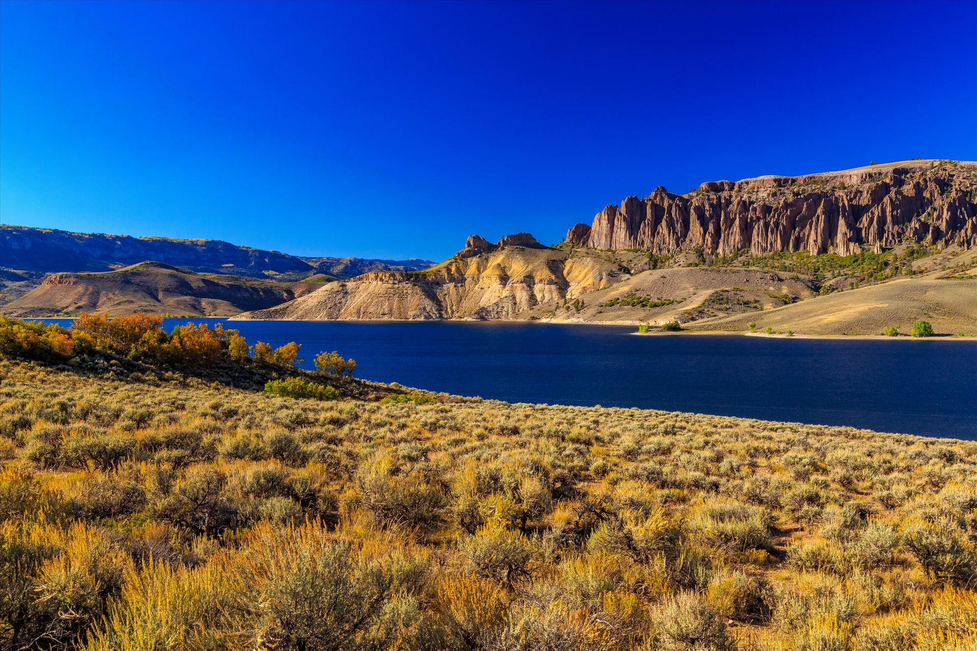 Dillon Pinnacles and Gunnison River - The Dillon Pinnacles tower over the beautiful Gunnison River, near Gunnison Colorado. by Scott Smith Photos