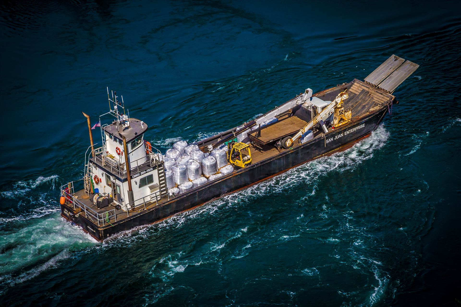 Crossing the Sound - A small ship crosses the Puget Sound in Washington. by Scott Smith Photos