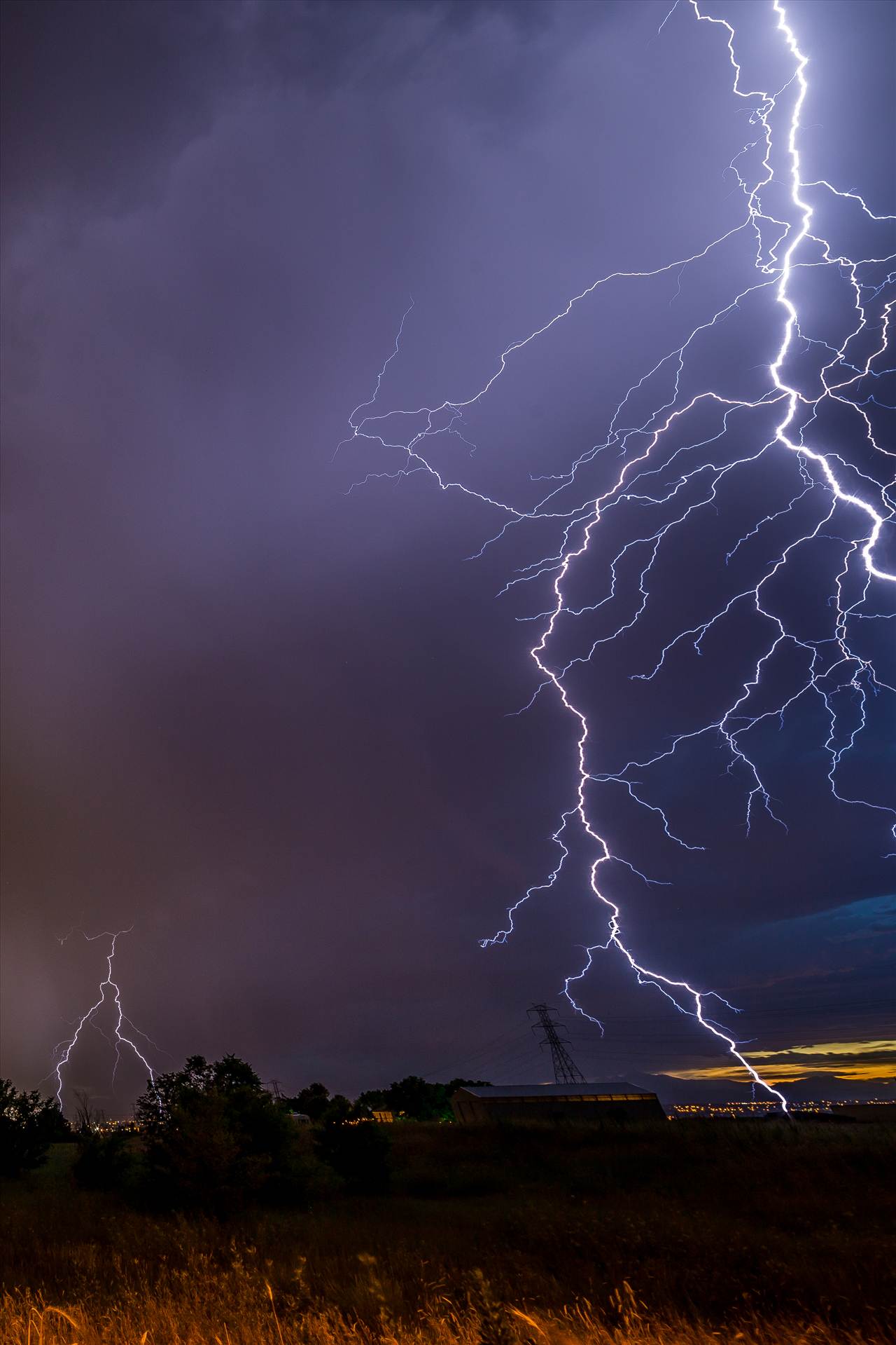 Lightning Flashes 9 - A series of shots from the end of the street, during a powerful lightning storm near Reunion, Colorado. This one was so close it did't fit entirely in the frame. by Scott Smith Photos