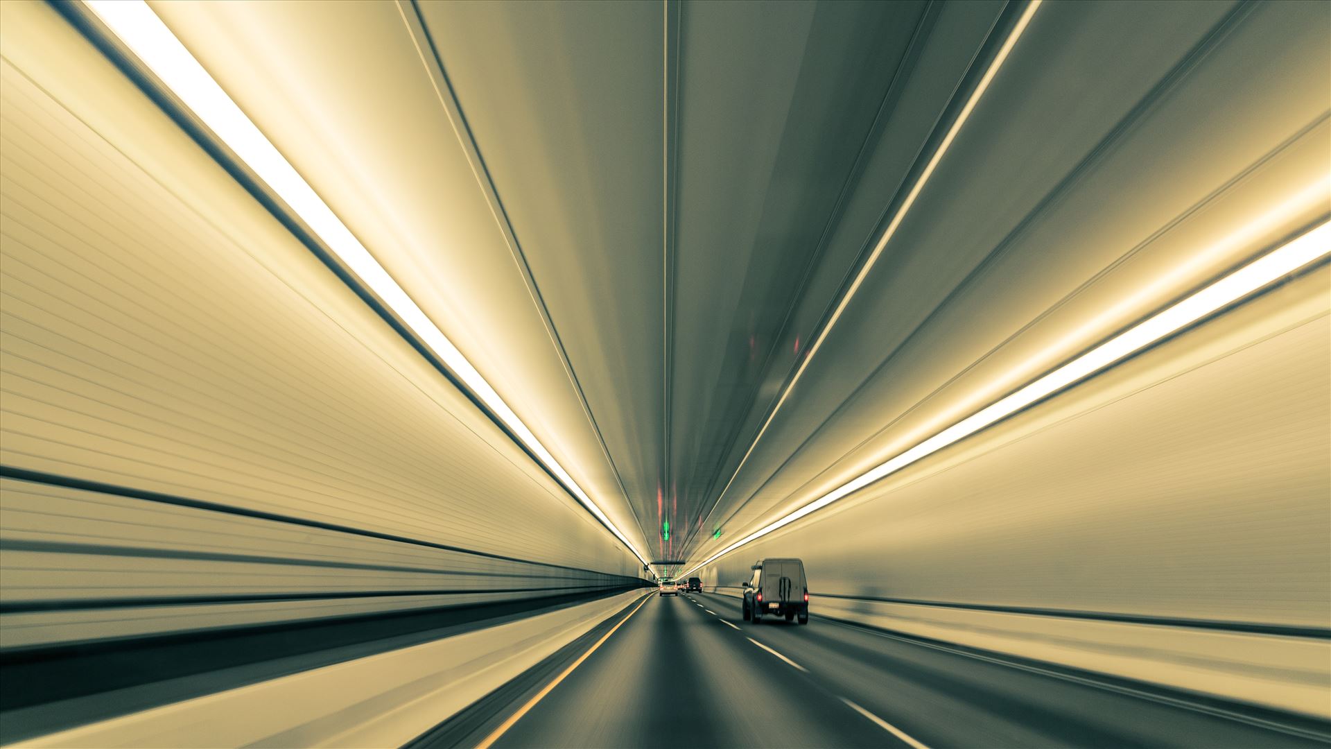 Converging Lines in Eisenhower Tunnel - Lines nearly converge to infinity, in this long exposure handheld shot in Eisenhower Tunnel. Opened in 1973, the Eisenhower Tunnel in the Rocky Mountains of Colorado on interstate 70 is highest vehicle tunnel in the world at 11,155 feet. by Scott Smith Photos