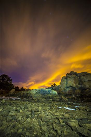 Clouds lit from distant Boulder and Denver light the sky at midnight.  From the shore of Mary's Lake a few miles near Estes Park, looking east towards Denver.