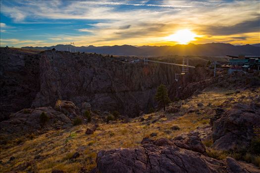 The sun sets over the bridge at the Royal Gorge, near Canon City, Colorado. The bridge is the highest bridge in North America, at almost 1,000 feet over the Arkansas River.