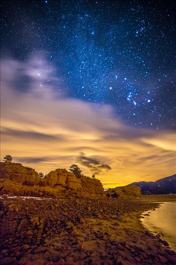 The milky way just manages to peek through the clouds, over Mary's Lake near Estes Park, Colorado.