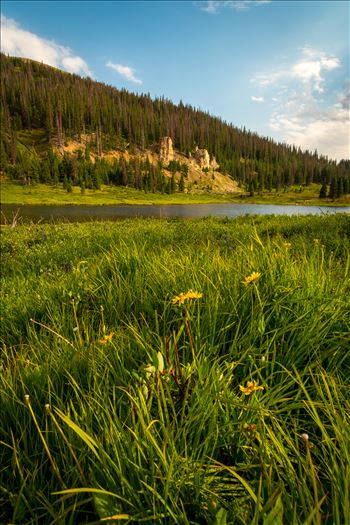 Evening sun lights the hills around Poudre Lake, on Trail Ridge Road.