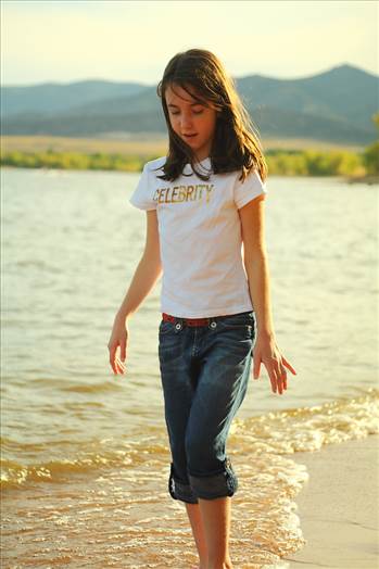 My daughter wwlking on the beach at Chatfield Resevoir, CO.